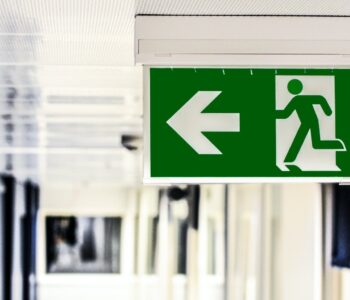 green and white male gender rest room signage