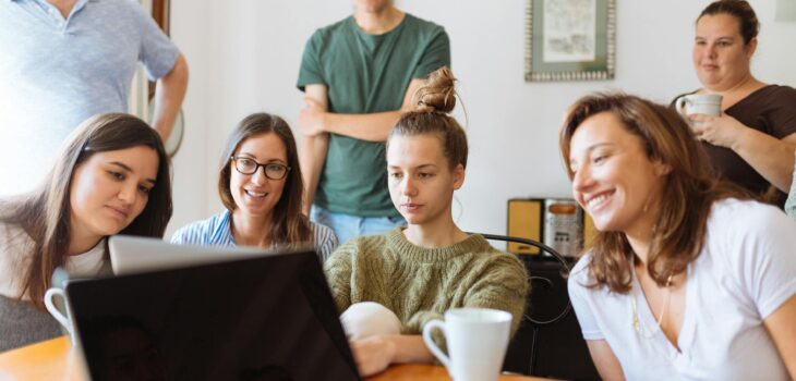 people looking at laptop computer