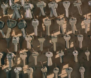 a variety of keys hanging on hooks