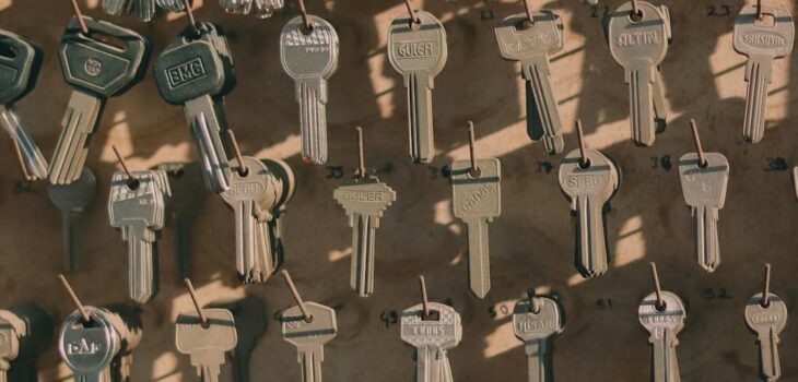 a variety of keys hanging on hooks