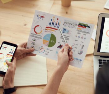 colleagues looking at survey sheet