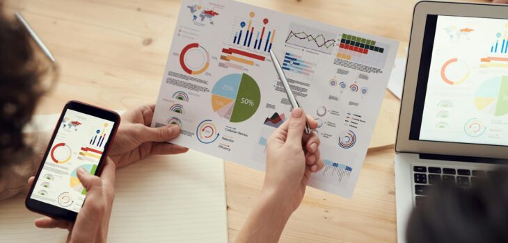 colleagues looking at survey sheet