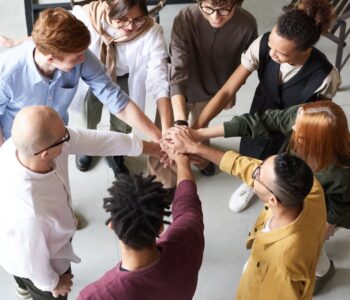 photo of people holding each other s hands