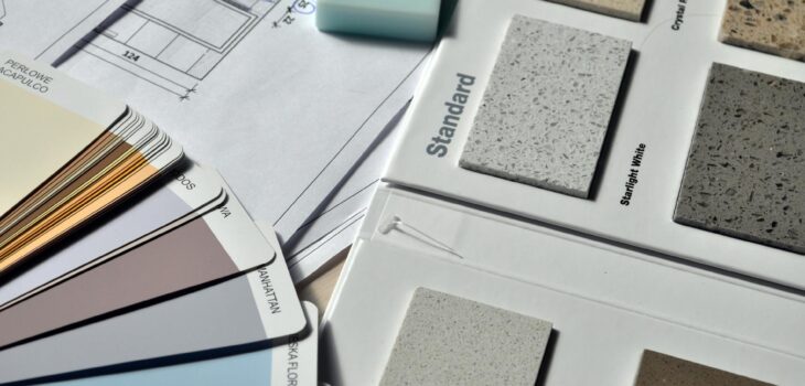 gray standard color book near green eraser
